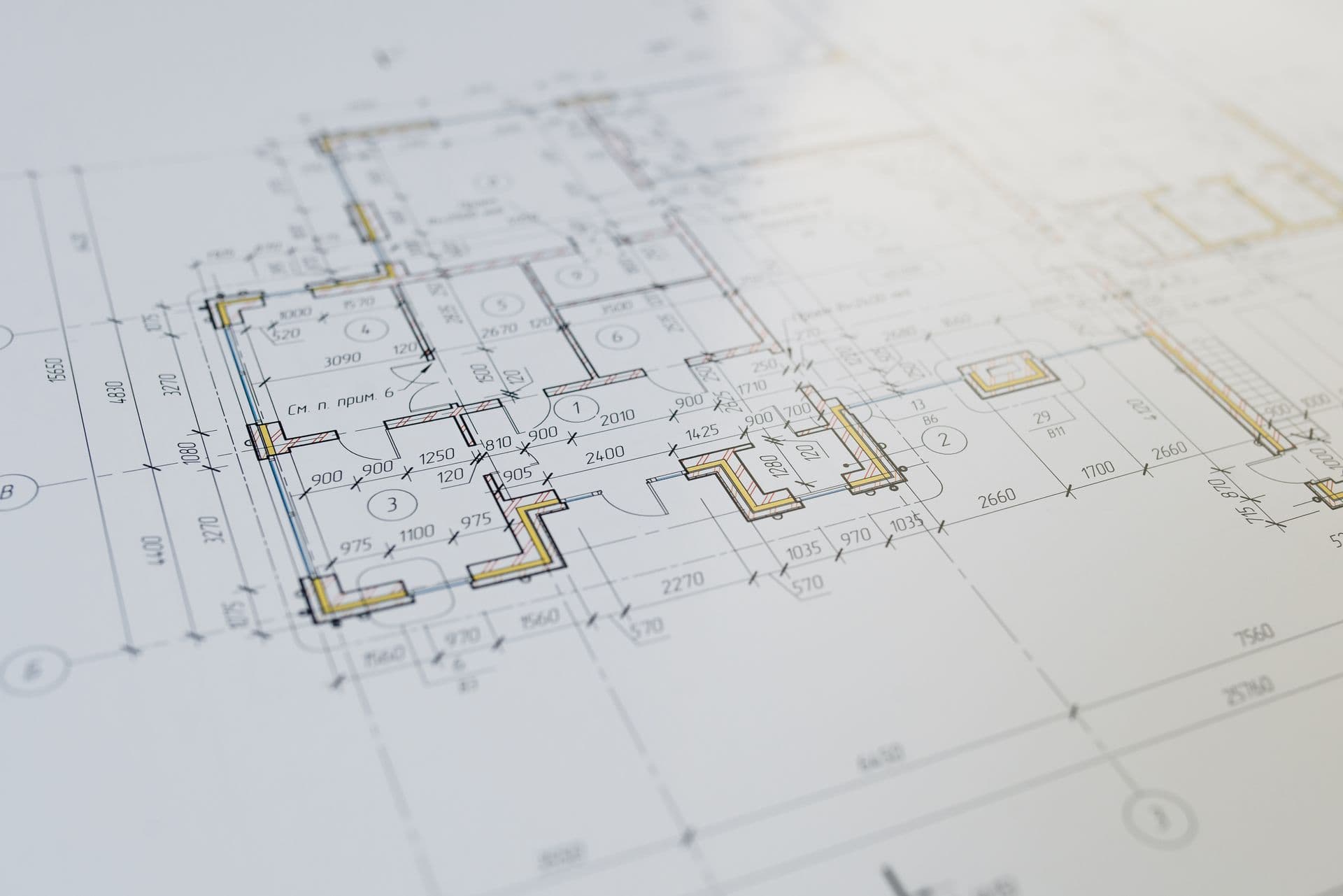 Close-up of a printed architectural floor plan with dimension lines and room labels